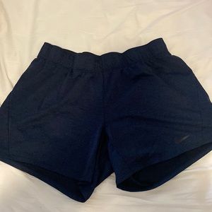 Nike Dri-Fit cotton shorts in a dark blue. Still has elastic in waist band